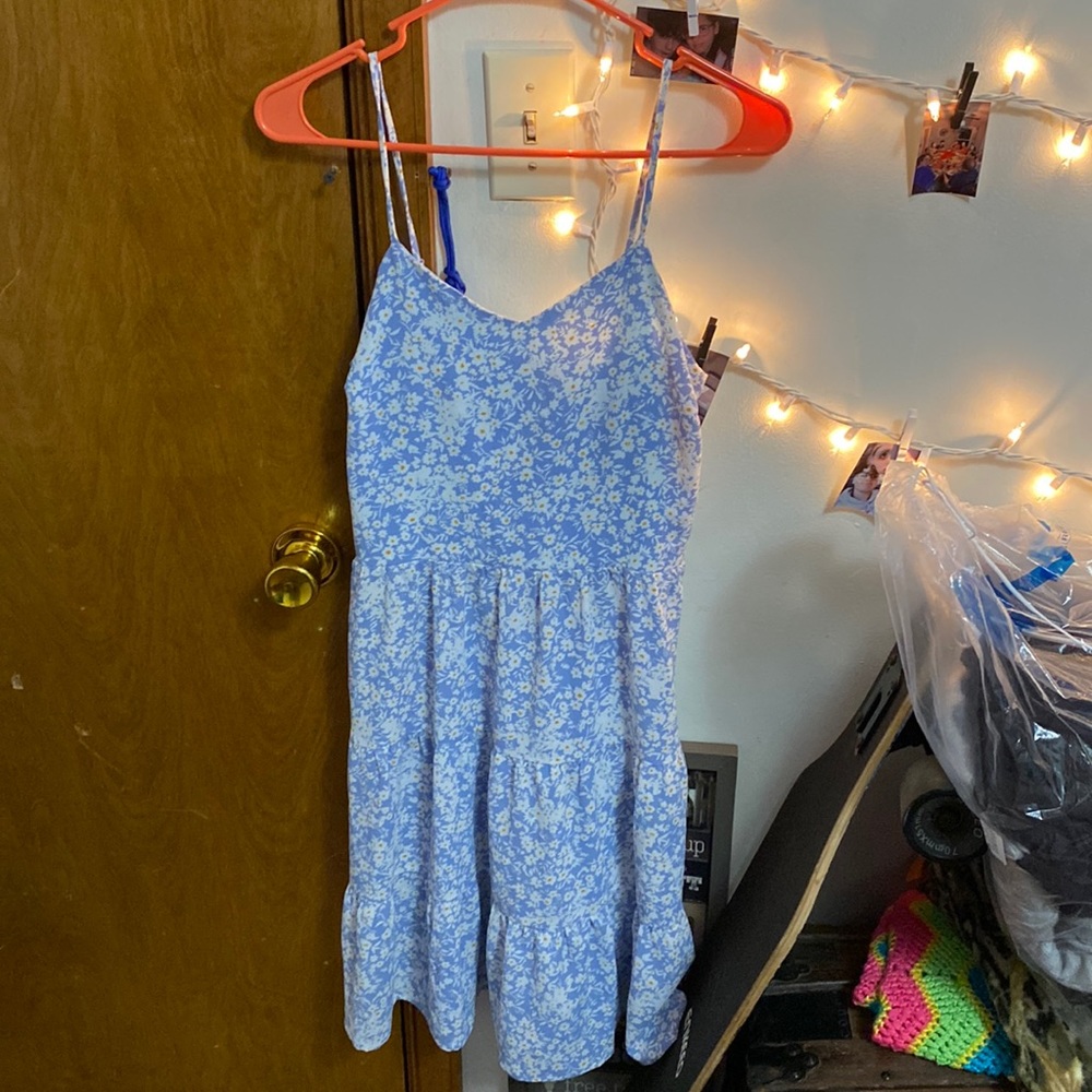 A medium blue dress with a flowery print